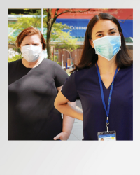 Two nurses standing together.